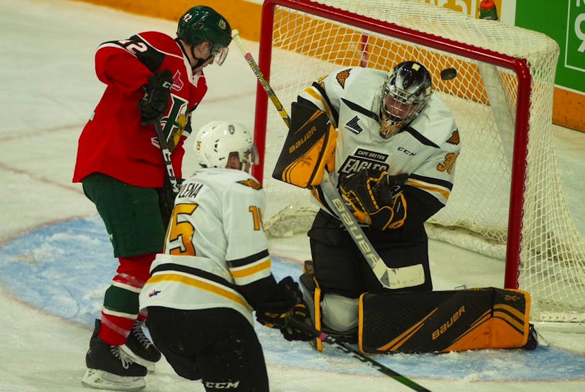 Halifax Mooseheads forward Zack Jones watches as a shot goes wide on Cape Breton Eagles goalie William Grimard during Friday night's QMJHL game at the Scotiabank Centre.