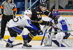 Shawn Element of the Cape Breton Eagles, centre, cuts across the crease as he’s pressured by Nathan Drapeau of the Saint John Sea Dogs, left, during Quebec Major Junior Hockey League action at Centre 200 on Wednesday. Cape Breton won the game 8-6.