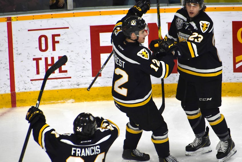 Brooklyn Kalmikov of the Cape Breton Screaming Eagles, right, celebrates after scoring a goal with his teammates Wilson Forrest, middle, and Ryan Francis during Quebec Major Junior Hockey League playoff action at Centre 200 on Wednesday. Cape Breton will host Charlottetown in Game 6 of the series on Sunday at 7 p.m. at Centre 200 in Sydney.