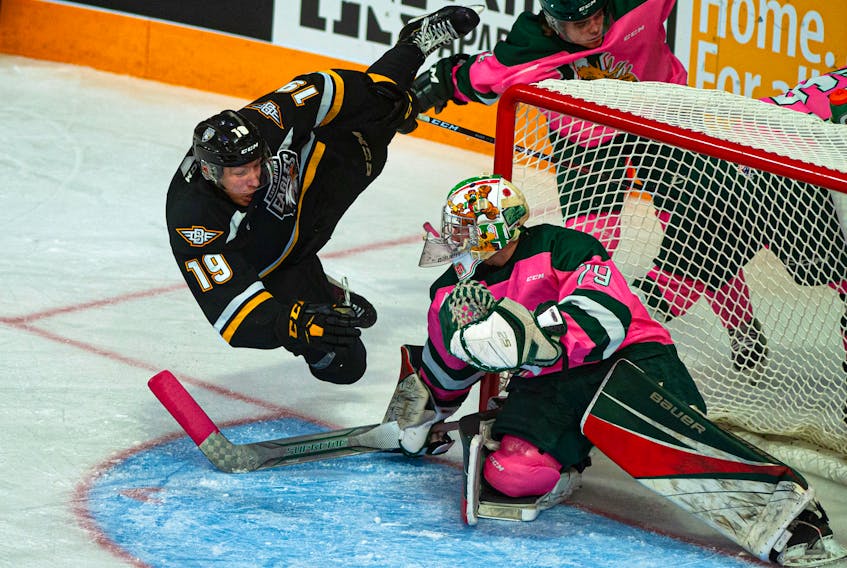 Cape Breton’s Shaun Miller flies through the air past Mooseheads goalie Cole McLaren during second period action in the Eagles’ 8-2 win before a crowd of 8,009 at the Scotiabank Centre on Saturday in Halifax. Miller, who plays on an all-Nova Scotia line with Liam Kidney and Sydney native Derek Gentile, has now scored in three consecutive games. Cape Breton, now on a four-game winning streak, hosts the Victoriaville Tigres on Thursday at Centre 200 in Sydney.