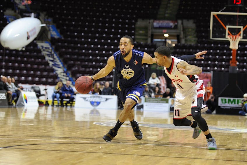 Coron Williams of the St. John's Edge moves the ball up the court while being guarded by Maurice Jones (11) of the Windsor Express during Game 3 of the National Basketball League of Canada divisional semifinal Wednesday night in Windsor, Ont. The Edge won 124-117 to take the best-of-five series in three straight games. — Windsor Express photo via St. John's Edge
