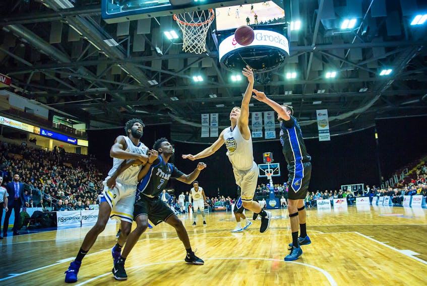 Friday night at Mile One Centre, the St. John's Edge got a strong performance from bench players including newcomer Anthony Stover (left) and Wally Ellenson, shown going up for a basket against the KW Titans. — St. John's Edge photo/Jeff Parsons