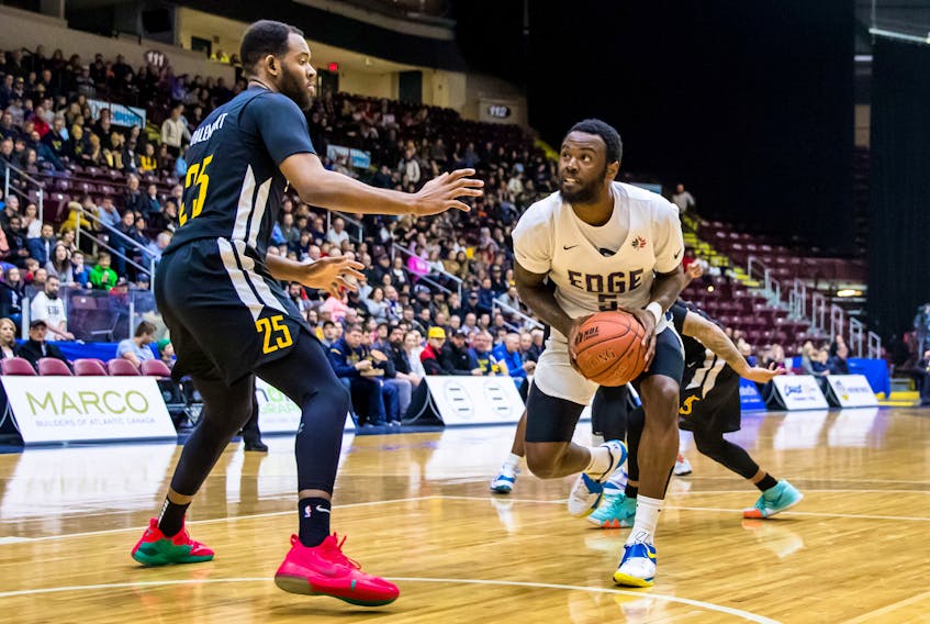 Dez Lee (5) of the St. John's Edge is shown going up against Yohanny Dalembert (25) of the Sudbury Five during Game 2 of an opening-round NBL Canada playoff series Sunday at Mile One Centre. Lee, the Edge's leading scorer, was injured and unavailable to St. John's in a 124-112 Game 3 loss to the Five in Sudbury, Ont., on Wednesday night. That result means the Five own a 2-1 lead in the best-of-five series heading into Game 4 Friday in Sudbury. — St. John's Edge photo/Jeff Parsons