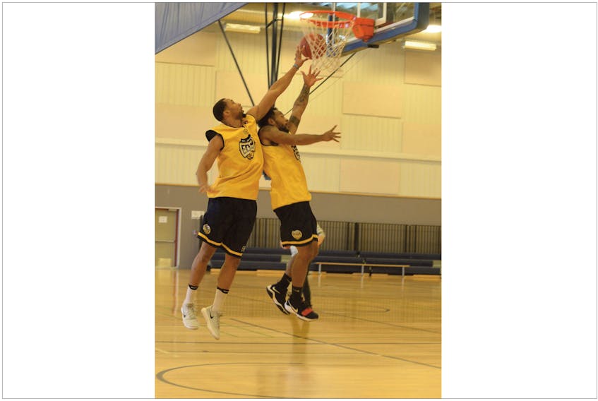 Aaron Williams (left) goes up to block a shot by Rashaun Broadus during workouts for the St. John’s Edge Monday morning at the Provincial Training Centre in St. John’s. The National Basketball League of Canada expansion team is in the midst of its training camp in preparation for its first-ever season, which begins with a road game Nov. 18. The Edge’s first home game is Dec. 1 at Mile One Centre, but hoops fans will have an opportunity to check out the prospective players in an intrasquad contest Thursday night at Mile One Centre. The price of admission for that game is a non-perishable food item.