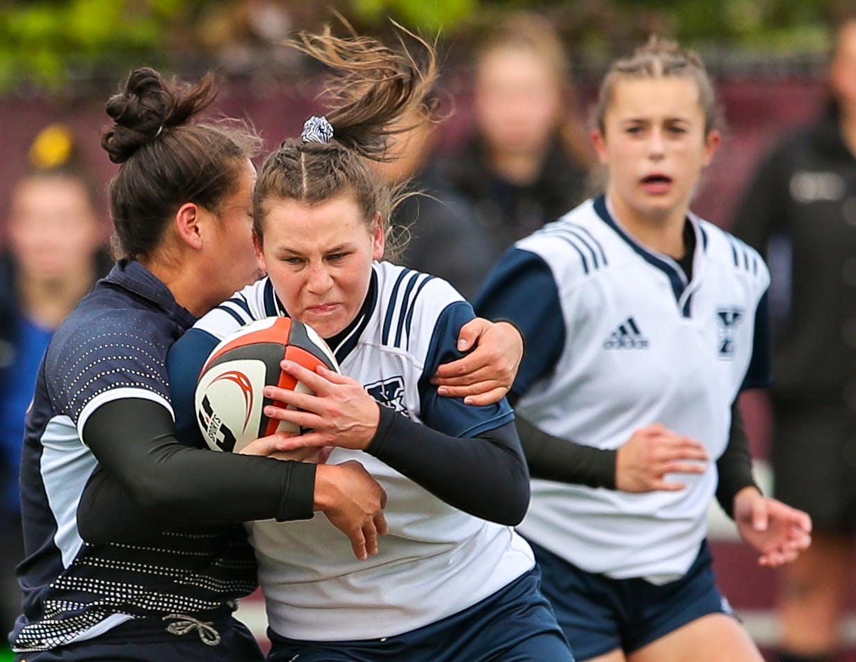 Hannah Ellis of the St. Francis Xavier X-Women breaks through a tackle against the Guelph Gryphons during quarter-final play at the 2019 U Sports women's rugby championship on Oct. 30 in Ottawa.   U SPORTS