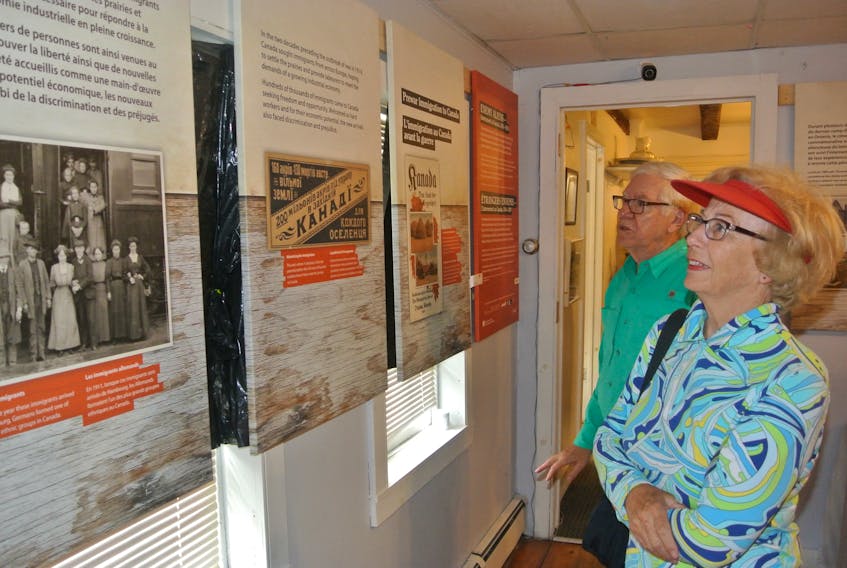 Phyllis Simms and her husband, Jeremy, from Mahone Bay look at the Enemy Aliens: Internment in Canada, 1914-1920 exhibit at the Cumberland County Museum following its opening on July 27.