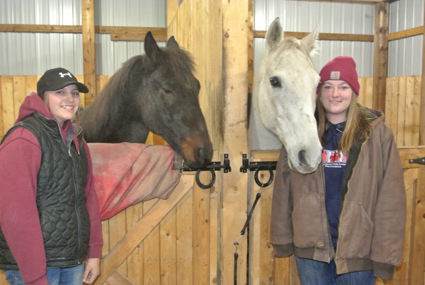 Katelyn Girouard (left) and Carly Bacon of Amherst qualified this past summer to compete at the 2021 NBHA world barrel horse racing championships next year in Georgia. They are shown with their horses Rocket (JT Rocket Hancock) and Spencer (Classy Effect).