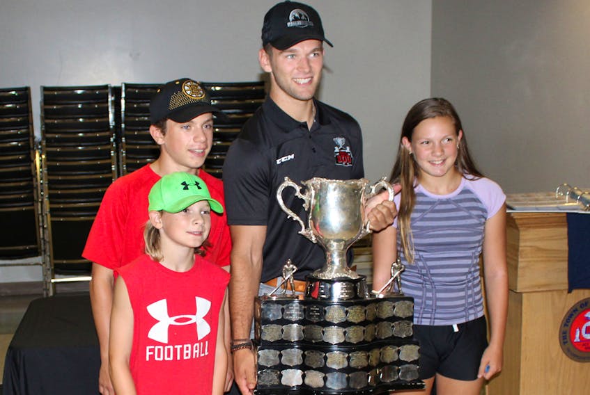 Sackville’s Ethan Crosman was in town last August with the Memorial Cup to meet with fans. Crossman helped lead his team, the Acadie-Bathurst Titan, to its first Canadian major junior championship win in franchise history during the 2017-18 season. Above, Crossman, second from right, poses with, left to right, Ben (foreground) Jack and Jamie Arsenault.