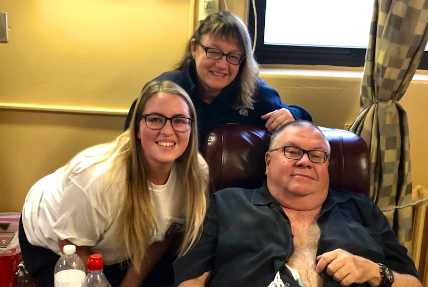 Evan, Gretchen and Bruce Phinney are shown last year in Halifax. Evan and Gretchen are collecting blood donation pledges to honour Bruce's memory. He died on Christmas Day in 2019.