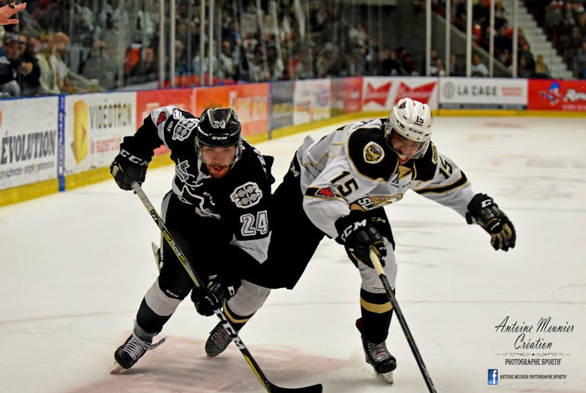 Charlottetown Islanders captain Pierre-Olivier Joseph, right, and Blainville-Boisbriand Armada forward Joel Teasdale race for the puck during Game 1 of the team’s QMJHL semifinal. Antoine Meunier Photo