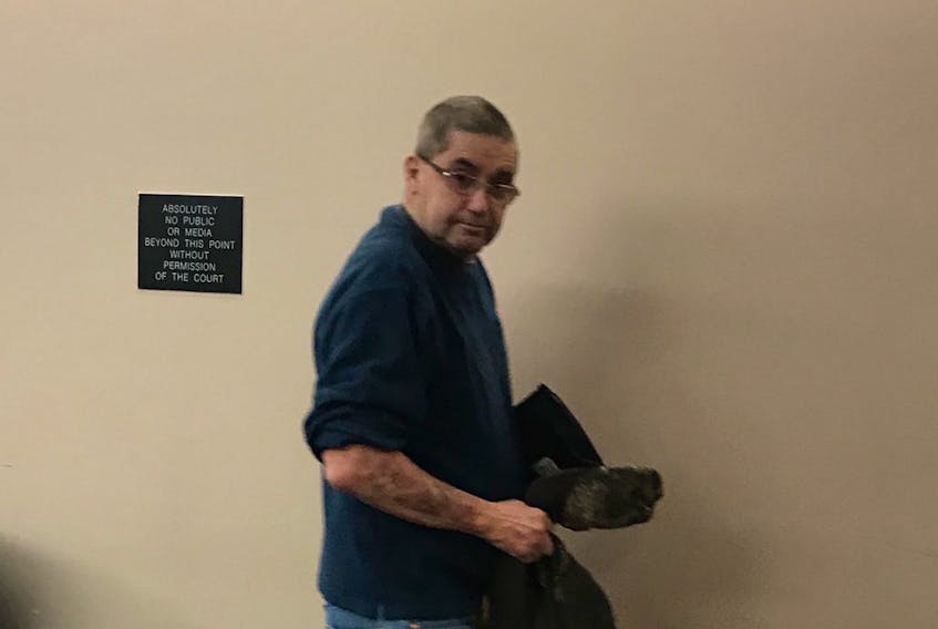 Jeff Duff, 54, of Goulds, leaves provincial court in St. John’s Friday morning. He has pleaded guilty to a charge of unlawfully killing an animal after he stabbed his pet cat to death.