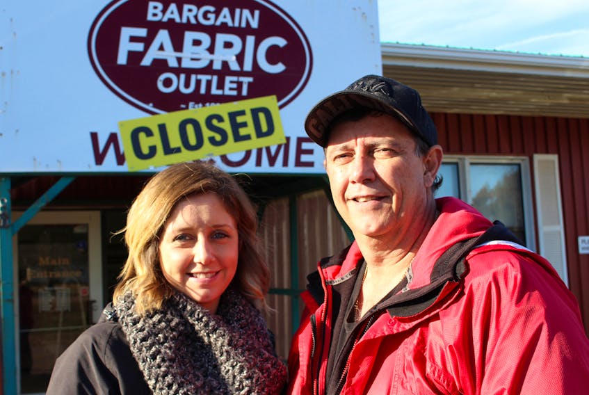 Ashley Guergis-Greencorn, left, and her father, Eddie Guergis outside the Bargain Fabric Outlet. MILLICENT MCKAY/THE GUARDIAN