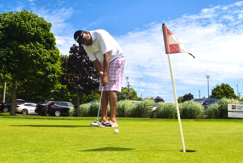 Golfer Wayne Talbot remembers a time when black people were banned from becoming golf club members – but were caddies for players who let them play at the crack of dawn. On Aug. 3, the golfer, now 70, lines up a practice shot on the green at the Truro Amateur Athletic Club grounds.