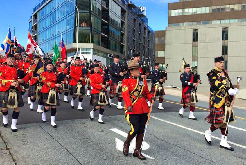 Marchers make their way from Halifax Regional Police headquarters to Grand Parade for the annual fallen peace officers memorial service on Sunday.