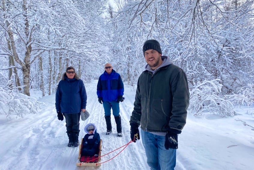 Far be it from me to tell these good people what to do, but wouldn't this make a stunning Christmas card?  Sharon and Paul Fudge were out for a stroll with their son, Shane, and Grandson, Wes, at the Old Town Site in Gander, N.L.  Someone had to take the photo, so Wes's mom Katherine stepped up to capture the magic.
