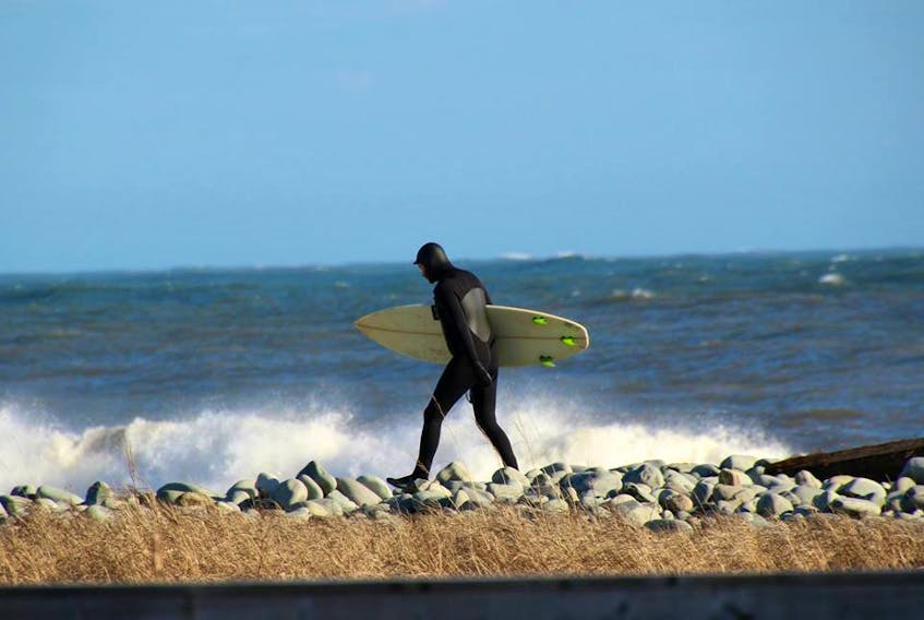 Lee Edgar headed out to surf last month, following one of our winter wallops.  There might now be any snow along the shore at Flag Pond in Eastern Passage, N.S., but that water is not warm!