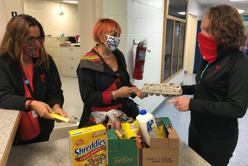 Cumberland-Colchester MP Lenore Zann (centre) discusses the Cumberland YMCA’s food program with YMCA CEO Trina Clarke (left) and community development manager Alison Lair.