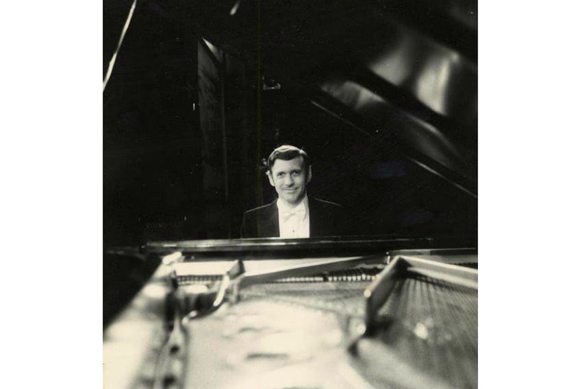 Joseph Fenwick “Fen” Watkin, O.C. sits at the grand piano during a performance of “By George!” at The Charlottetown Festival in 1976. The music man died Thursday in Toronto. He was 96.  - Confederation Centre archives