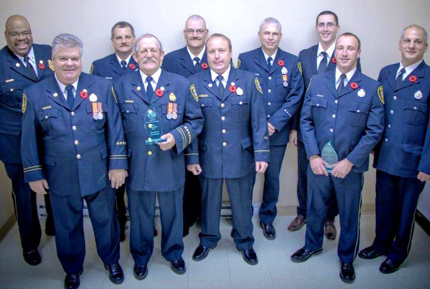 Several Amherst firefighters were recognized Nov. 4 for their service to the Amherst Fire Department. Among those recognized were: (front, from left) Capt. David Ralston, Capt. Vern Megeney, Lt. Paul Lacey, Allen Martin and Dwight Wheaton. (back, from left) Fire Chief Greg Jones, Craig Churchill, Trevor Gaillard, Steven Wood and Kevin Lepage. (Brent Cameron/BRC Production photo)