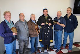 Members of the Brine family were in Port Elgin on Saturday to present the original dress uniform of the late Desmas Brine to the Port Elgin fire department. Shown here are, left to right: Brine family members Lowell Brine, Art Chase, Ed Brine and Jamie Brine, Port Elgin fire chief Steve Alward, deputy-chief Rob Walton.  JOAN LEBLANC PHOTO