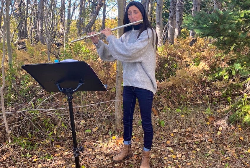 Flutist Morgan Saulnier is shown performing at Tuning into Nature in Tryon earlier this month.