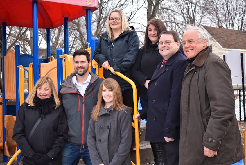 New Glasgow Mayor Nancy Dicks, Central Nova MP Sean Fraser and members of council and other community players at a playground at the Westside Community Centre that received federal funding to make it more inclusive.