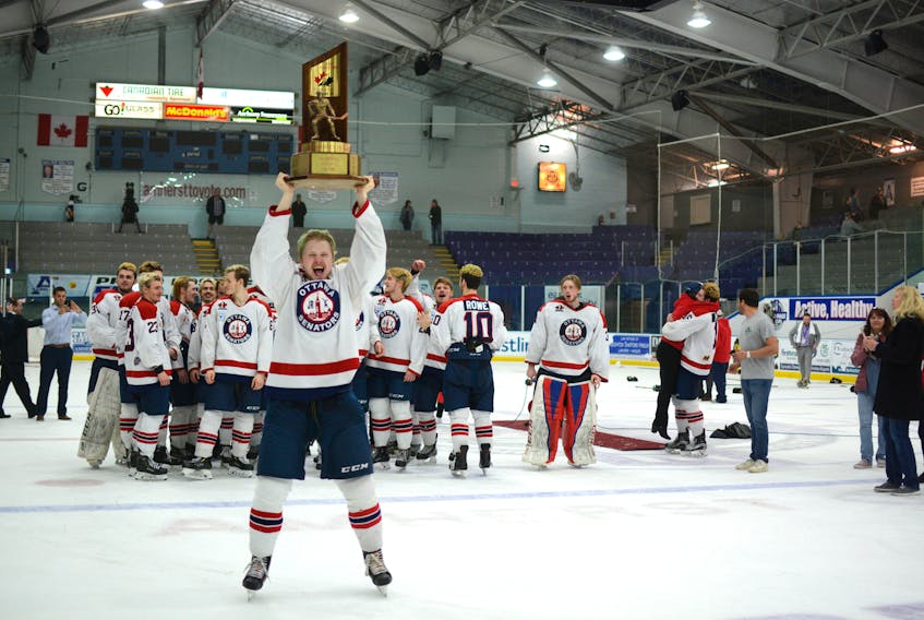 Ottawa Junior Senators’ defenceman Taylor Egan celebrates with the Fred Page Cup after a 9-2 win over the Princeville Titan on Sunday in Amherst. The Senators, who had a last-second win over Amherst in Saturday’s semifinal, scored four times in the second period to defeat the top-seeded Titan.
