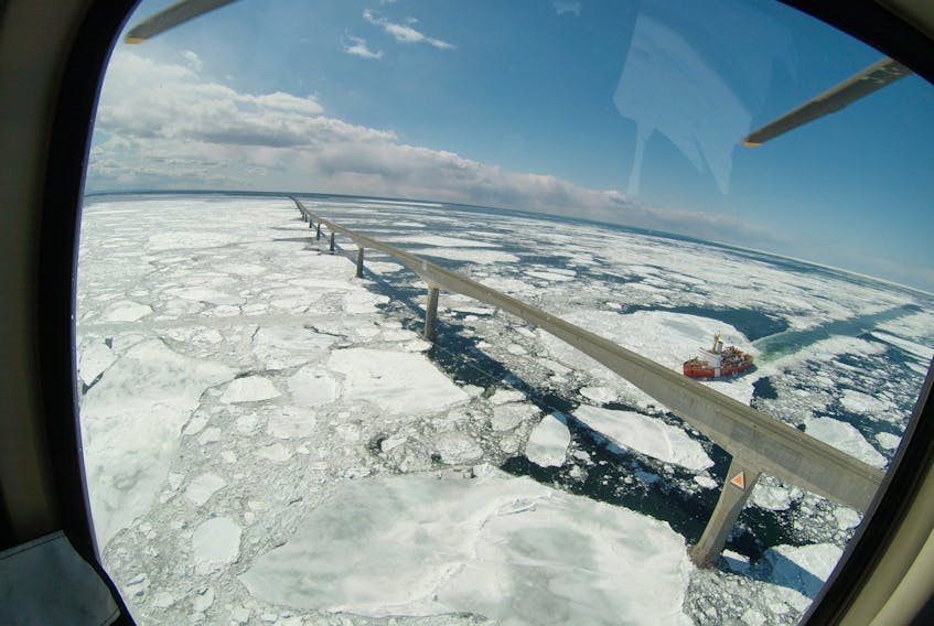 A Canadian Coast Guard icebreaker cuts a path through the Northumberland Strait and under the Confederation Bridge in this aerial shot. Ice conditions around P.E.I. are improving by the day, but there is still considerable ice in Northern New Brunswick which is delaying the start of the snow crab fishery.