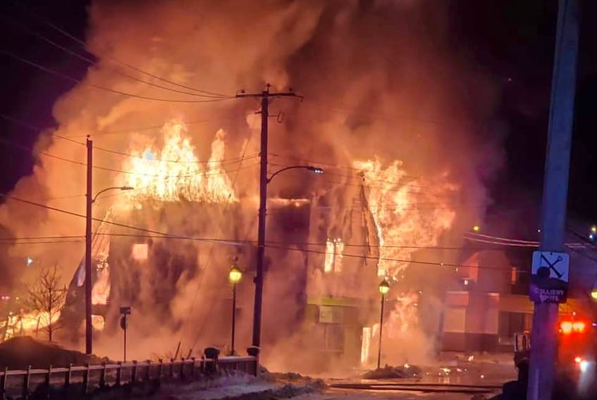 Flames engulf a two-story building located at the corner of Commercial and Catherine streets in Glace Bay on Jan. 18. Six fire departments responded to the call, keeping flames from spreading to other businesses and homes close by. Multiple businesses were located in the building including Coastal Vapor, Bud's Emporium and Bel's Beauty Boutique. NIKKI SULLIVAN/CAPE BRETON POST