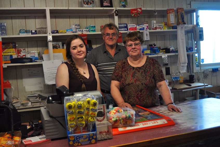 Student Tori Skinner (left) works at Coley's Store in Ramea during the summer. Owner Francis Coley and her brother, George Barter, are there year round.