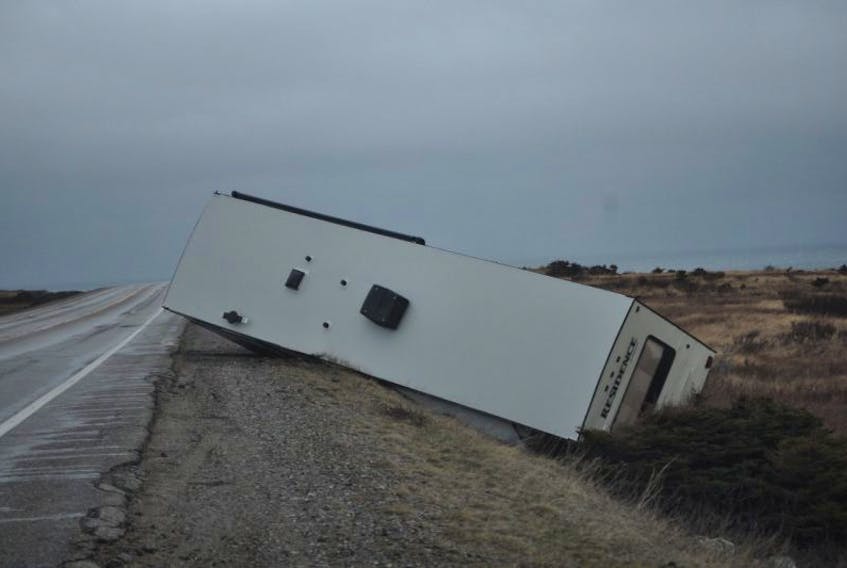 A recreational trailer landed in the ditch after encountering the gusty Wreckhouse winds.