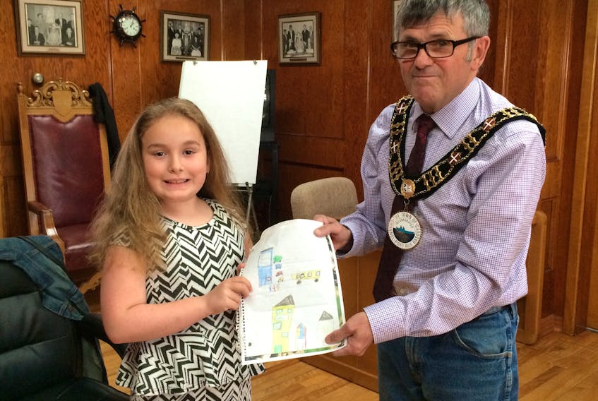 Emily May with Port aux Basques Mayor John Spencer.