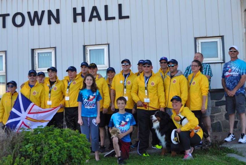 Crewmembers from the HMCS St. John’s posed for photos in front of Port aux Basques town hall.