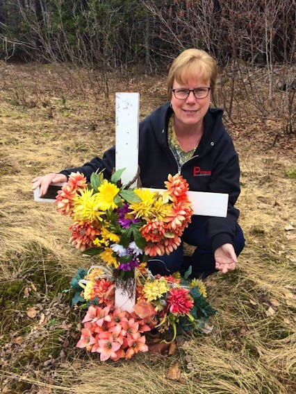 Grace Pittman visits the highway memorial dedicated to her husband Wayne Lush who was killed on Sept. 27, 1981 when the car he was driving struck a moose on the Trans-Canada Highway near Port Blandford. CONTRIBUTED