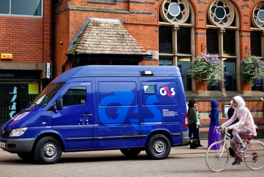 A G4S security van is parked outside a bank in Loughborough, central England.