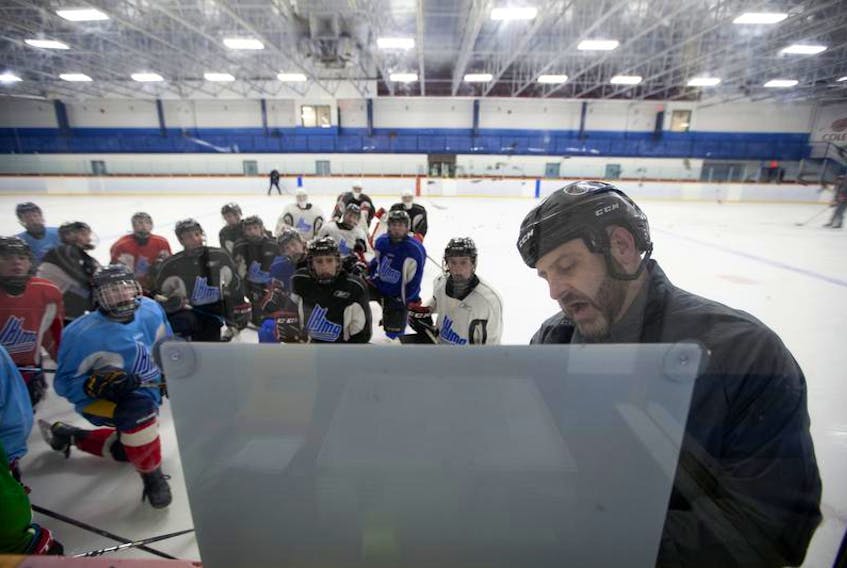 Head coach Andre Lefebvre goes over game plan at a recent Cole Harbour Wolfpack practice.