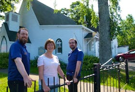 Since 1992, the former St. John the Baptist Anglican Church in Waverley has been home to the Waverley Heritage Museum and its collection of artifacts preserving the village’s history and culture. From left are, Aaron Clarke, the museum’s summer coordinator; Pat Clahane, chairperson of the Waverley Historical Society; and summer coordinator Jeff Bowden.