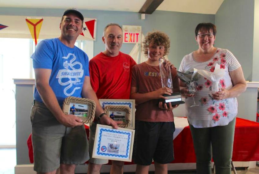 Henry Pedro (from left) organizer of the East Coast Albacore Championship, poses with this year’s winners; Raines Koby and Rafael Pedro and Susan Stewart, Commodore of the Shelburne Harbour Yacht Club.