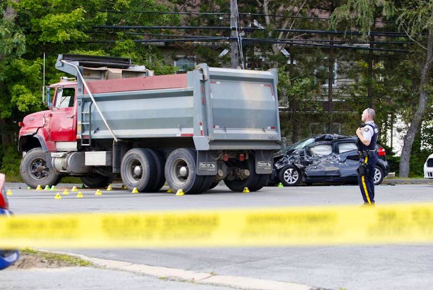 RCMP closed a section of Highway 2 at Holland Road in Fall River Sept. 20, 2018 to investigate a collision between a dump truck and a small car. A Lower Sackville woman died in the crash. (Eric Wynne / The Chronicle Herald)