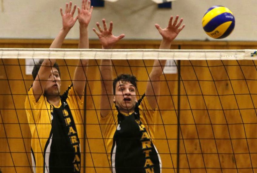 Dartmouth High’s A. Gallant, left and O. Schrader block a JL Ilsley’s spike during metro high school volleyball action at Ilsley on Monday September 23, 2018. Tim Krochak/ The Chronicle Herald