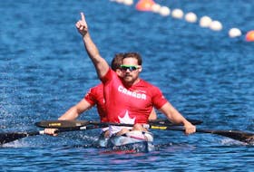Canada’s Mark De Jonge, front, with teammate Alex Scott celebrate after winning the senior men’s K-2 200-metre final at the Pan Am and Para sprint canoe championships on Lake Banook in Dartmouth on Friday.