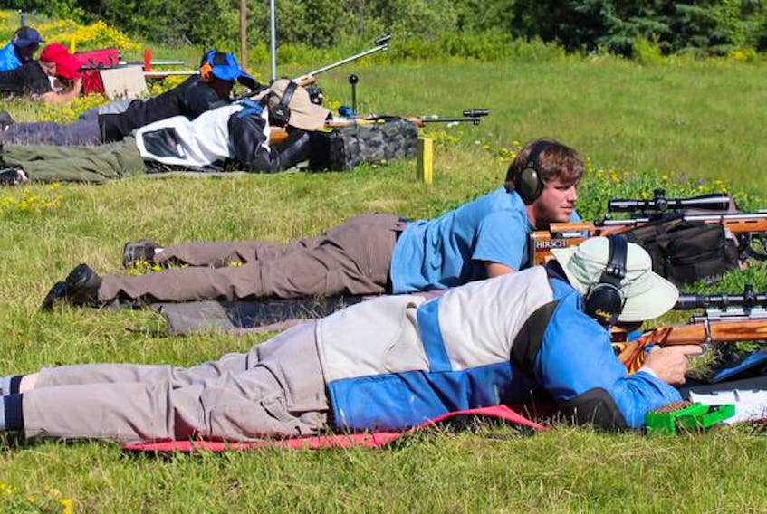 National shooting champion Adam MacDonald is second from the front at the provincial match in Gagetown, N.B., in July.