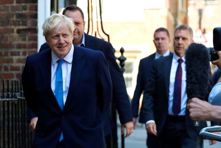 Boris Johnson walks outside his campaign headquarters after being announced as Britain's next prime minister in London on Tuesday, July 23, 2019.