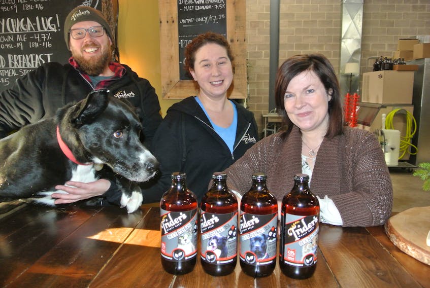 Joe Potter, Sarah Parker and Magic of Trider’s Craft Brewery and Terri McCormick of the L.A. Animal Shelter show off Gimme Shelter, a session ale that’s being sold in support of the animal shelter on the Smith Road in Upper Nappan.