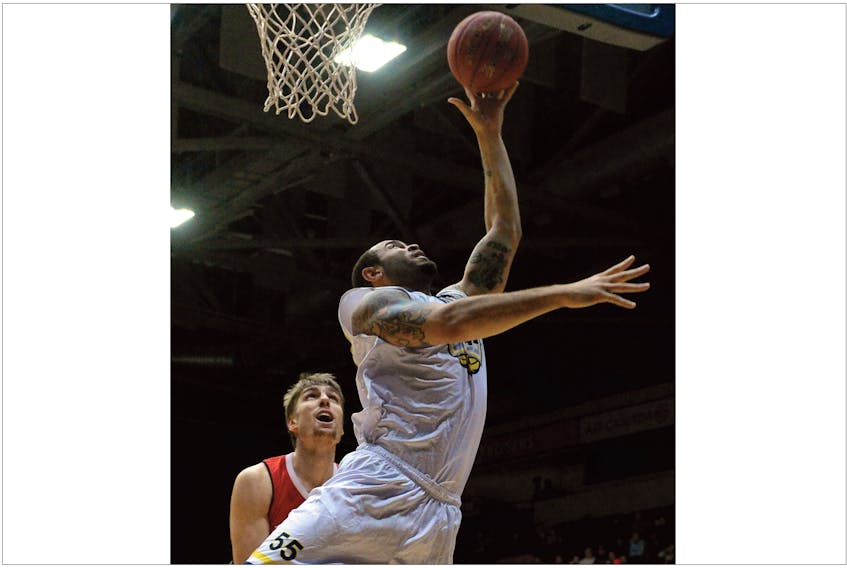 Grandy Glaze of the St. John's Edge goes up for a basket as Logan Stutz of the Windsor Express looks on Wednesday night at Mile One Centre.