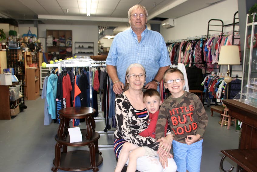 Laura and John McFadden sometimes have their grandchildren Daniel, 4, and Brandon, 7, join them at Grammy’s Thrift Store. The shop recently relocated to Robie Street.
