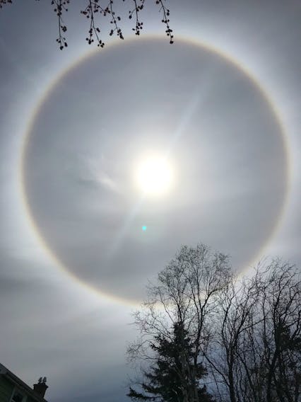 Look up… way up!
Jack Devenney was sitting in his backyard in Dartmouth NS Sunday afternoon, enjoying the fine day, when he looked up and spotted the giant ring.  He snapped this gorgeous photo and says that the halo stayed visible for quite some time.