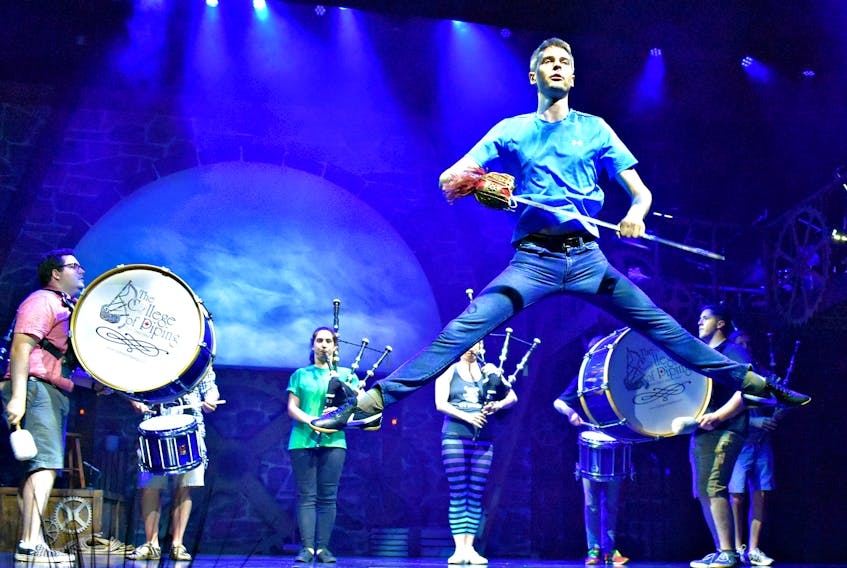 World champion Highland dancer Daniel Carr leaps into the air during a rehearsal scene for the College of Piping and Celtic Performing Arts summer show, Great Scot!