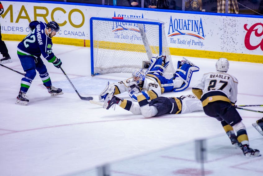 The Maine Mariner's Morgan Maison-Adams (left) scored past a sprawling Newfoundland Growlers netminder Maksim Zhukov on a power play with 73 seconds remaining in the game to give the Mariners the winning goal in what would be a 3-1 ECHL victory Saturday night at Mile One Centre. It was Newfoundland's first loss at Mile One after an ECHL-record 19 home-ice wins. — Newfoundland Growlers photo/Jeff Parsons