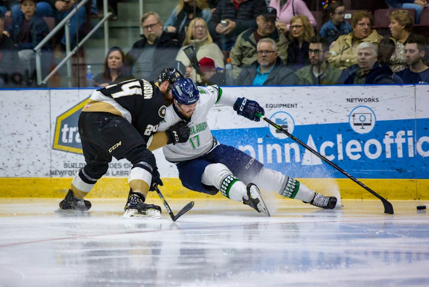 Newfoundland Growlers defenceman Alex Gudbranson takes Justin Auger of the Florida Everblades out of the play in Game 4 of their ECHL Eastern Conference final game Friday night at Mile One Centre. The Growlers won 6-0 to take a 3-1 series lead, with Game 5 tonight (Saturday) at Mile One.